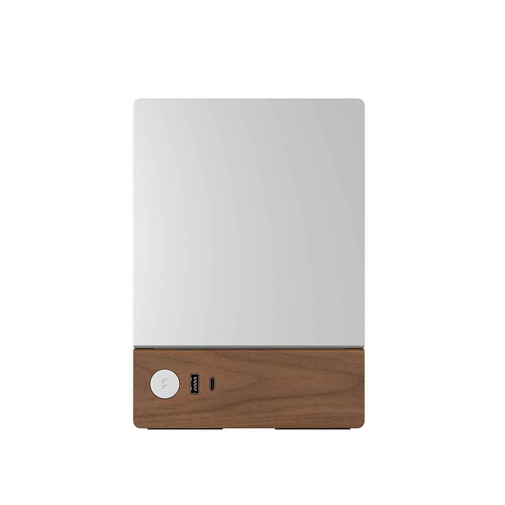 White electronic device with wooden base on a white background