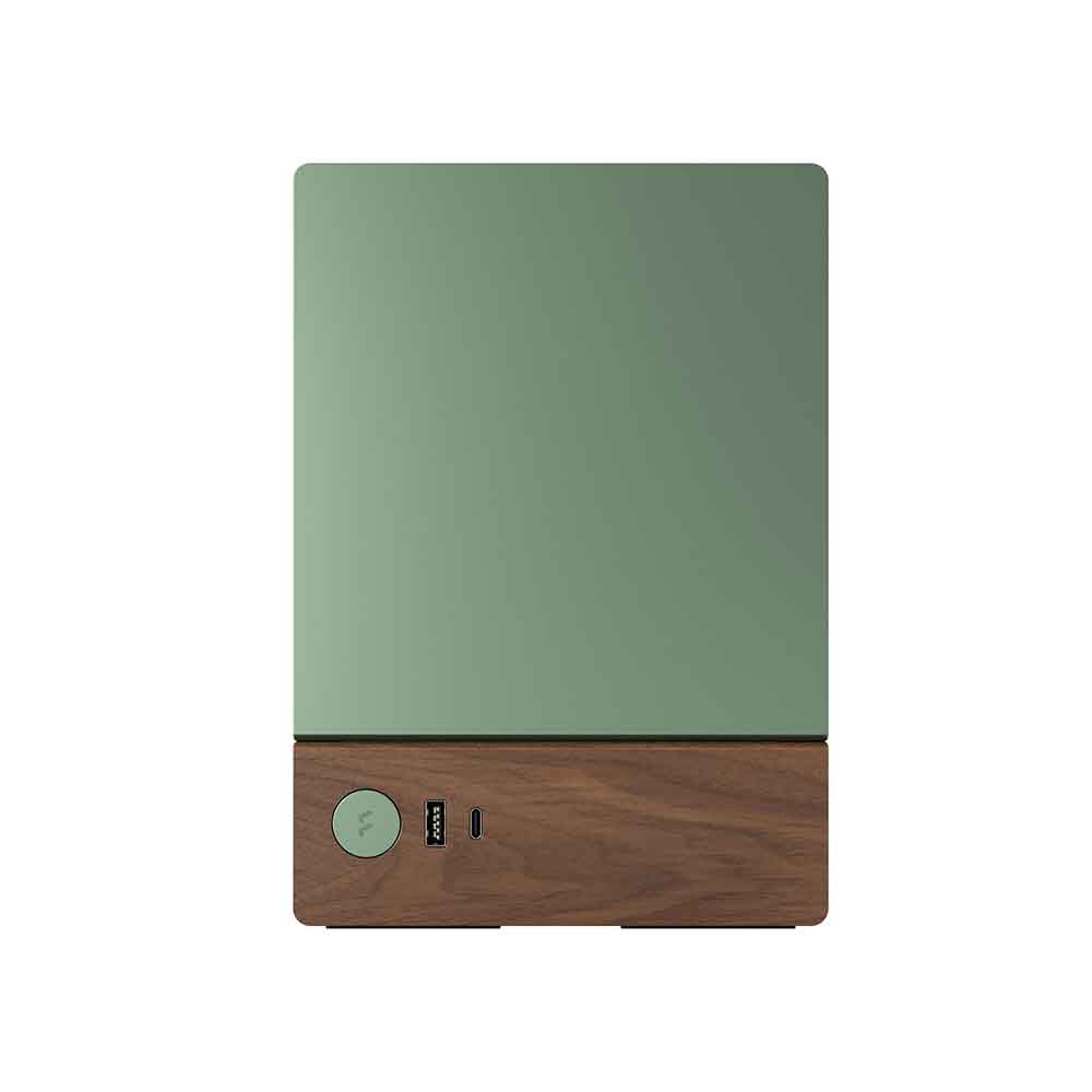 Green electronic device with wooden base on a white background